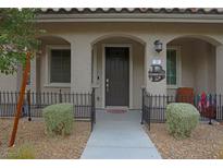 Inviting home exterior featuring a stylish front door and well-manicured landscaping at 20 Barbara Ln # 20, Las Vegas, NV 89183