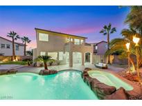 Luxury pool and spa with rock waterfall feature, perfect for entertaining at 11268 Bedford Hills Ave, Las Vegas, NV 89138