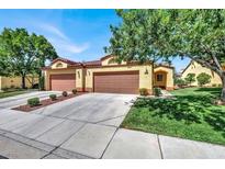 Front view of a two-story house with attached garage and manicured lawn at 1131 Evening Ridge St, Henderson, NV 89052