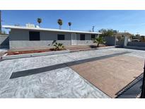 Newly renovated single-story home with a large driveway and landscaped front yard at 2804 La Canada St, Las Vegas, NV 89169