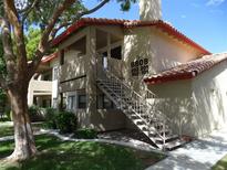 Two-story building exterior with stairs and landscaping at 8808 River Pines Ct # 201, Las Vegas, NV 89117