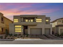 Modern two-story home with gray exterior, and three car garage at 10749 Steel Ridge Ct, Las Vegas, NV 89135