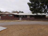 Ranch style home with brick exterior and a metal roof at 2925 Rice St, Logandale, NV 89021