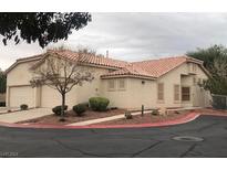 Tan two-story house with tile roof and two-car garage at 3421 Wexford Ln # 102, Las Vegas, NV 89129