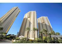 Luxury highrise building with palm trees and blue sky at 145 E Harmon Ave # 2504, Las Vegas, NV 89109