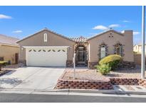 Single-story house with a two-car garage and desert landscaping at 3611 Winter Wren St, Las Vegas, NV 89122