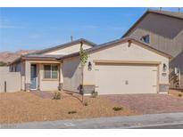 One-story house with attached garage, landscaping, and desert-like surroundings at 6725 Violet Cascade Ave, Las Vegas, NV 89156