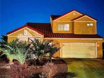 Stunning two-story house with a charming front yard, at night at 1706 Toltec Cir, Henderson, NV 89014