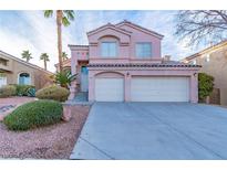 Two-story house with a three-car garage and landscaped front yard at 2277 Black Pine Dr, Las Vegas, NV 89134