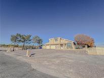 Two-story house with a three-car garage and gated driveway at 380 E Maulding Ave, Las Vegas, NV 89123