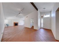 Bright living room featuring tile floors and a fireplace at 5255 Dickens Dr # 0, Las Vegas, NV 89119