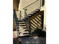 Exterior stairs with metal railings leading to a building entrance at 601 Cabrillo Cir # 648, Henderson, NV 89015