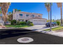 Two-story house with a three-car garage, landscaping, and palm trees at 1819 Wild Indigo Ct, Las Vegas, NV 89123