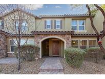 Inviting two-story home with arched entryway and landscaped front yard at 3081 Paladi Ave, Henderson, NV 89044