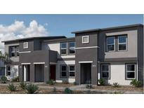 Contemporary three-unit building with gray siding and red garage doors at 9363 Serene Harbor St # Lot 59, Las Vegas, NV 89178