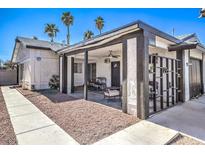 Home exterior showcasing a covered patio and landscaping at 4681 Via San Rafael, Las Vegas, NV 89103