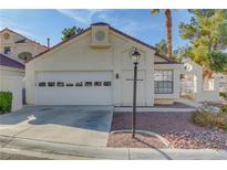 Updated single story home with attached garage and landscaped front yard at 7209 Crooked Bow Cir, Las Vegas, NV 89149