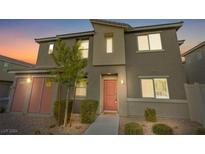 Two-story townhome with a modern design and landscaped front yard at 12280 Golden Wreath Rd # 4, Las Vegas, NV 89183