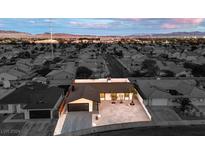 Aerial view of a single-story house with a well-manicured lawn, showcasing its location in a residential neighborhood at 4260 Twilight St, Las Vegas, NV 89122