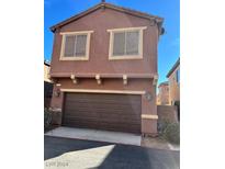 Two-story house with brown garage door and window screens at 715 Taliput Palm Pl, Henderson, NV 89011