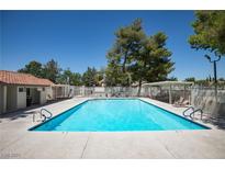 Community pool with lounge chairs and covered seating at 459 Kelsford Dr, Las Vegas, NV 89123