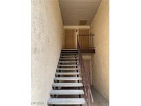 Exterior metal staircase leading to apartment entrances at 5427 Indian River Dr # 418, Las Vegas, NV 89103