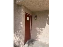 Exterior view of a red front door entrance to a building at 1455 E Katie Ave # K13, Las Vegas, NV 89119