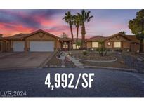 Stunning desert home with mature landscaping and three-car garage at 4775 N Grand Canyon Dr, Las Vegas, NV 89129