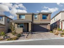 Two-story house with a two-car garage and landscaped front yard at 391 American Dipper St, Las Vegas, NV 89138