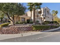 Two-story house with landscaping and a three-car garage at 9900 Summer Ash Ct # 103, Las Vegas, NV 89134