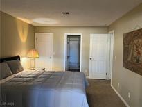 Cozy bedroom with a bed, nightstand, and ensuite bathroom at 1400 Santa Margarita St # B, Las Vegas, NV 89146