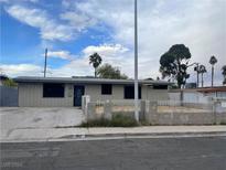 Single-story home with a fenced front yard and driveway at 1812 Ryan Ave, Las Vegas, NV 89101