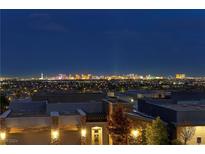 Stunning nighttime view of the city skyline from the property at 6160 Banded Stones Ct, Las Vegas, NV 89135