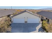 Two-car garage with neutral color exterior at 2541 E Ambush St # A, Pahrump, NV 89048