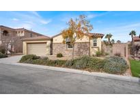 Single-story home with stone accents and a two-car garage at 7738 Comanche Canyon Ave, Las Vegas, NV 89113