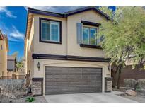 Two-story house with gray siding, brown garage door, and landscaping at 4727 Sweeping Glen St, Las Vegas, NV 89129