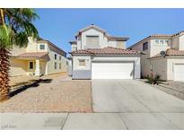 Two-story house with a white garage door and landscaped yard at 3354 Ceremony Dr, Las Vegas, NV 89117