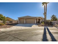 Single-story house with three-car garage and desert landscaping at 7200 Rustic Meadow St, Las Vegas, NV 89131