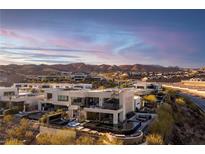 Modern home with rooftop deck, pool, spa, and scenic mountain views at 32 Highland Cove Ln, Henderson, NV 89011