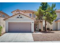 Two-story house with attached garage and desert landscaping at 10142 Rice Paper St, Las Vegas, NV 89183