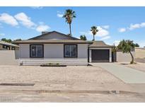 Ranch style home with gray exterior, and gravel landscaping at 5111 Orinda Ave, Las Vegas, NV 89120
