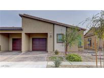 Single-story house with brown doors and a paved driveway at 7530 Cooks Meadow St, North Las Vegas, NV 89084