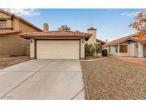 Single-story house with a beige exterior, tile roof, and attached garage at 7556 Kalmalii Ave, Las Vegas, NV 89147