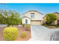 Two-story house with attached garage and manicured lawn at 11204 Newbury Hills Ave, Las Vegas, NV 89138