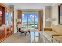 Living room with city views, comfortable seating, and elegant decor at 135 E Harmon Ave # 1702, Las Vegas, NV 89109