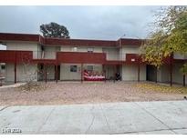Two-story apartment building with gravel landscaping and street parking at 5436 Swenson St # 16, Las Vegas, NV 89119