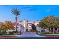 Stunning two-story home with a large driveway and palm trees at 2660 Mirabella St, Henderson, NV 89052