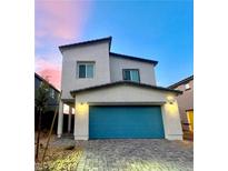 Two-story house with teal garage door and landscaped front yard at 7585 Love Harbor Ln # Lot 28, North Las Vegas, NV 89084