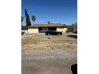 One-story home with attached garage, driveway, and gravel landscaping at 1778 Cypress Trl, Las Vegas, NV 89108