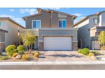 Two-story home with attached garage, landscaped yard, and paved driveway at 8831 Sasquatch Run Ave, Las Vegas, NV 89166